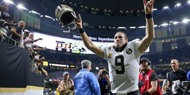 New Orleans Saints quarterback Drew Brees runs off the field after a game against the Washington Redskins at the Mercedes-Benz Superdome.