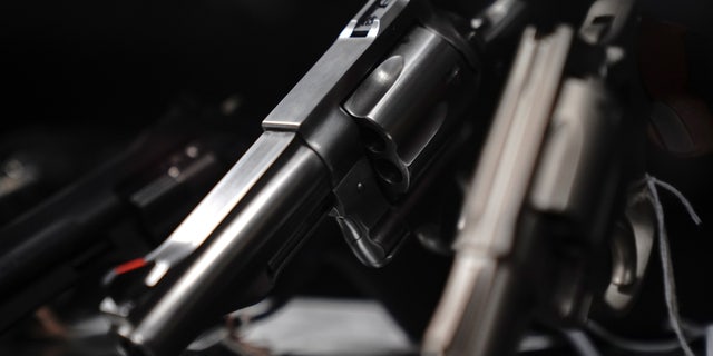 Revolvers are displayed for sale at Firearms Unknown, a gun store in Oceanside, California, U.S., April 12, 2021.