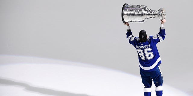 Tampa Bay Lightning right wing Nikita Kucherov hoists the Stanley Cup after the Lightning defeated the Montreal Canadiens 1-0 in game five to win the 2021 Stanley Cup Final on July 7, 2021, at Amalie Arena in Tampa, Florida.