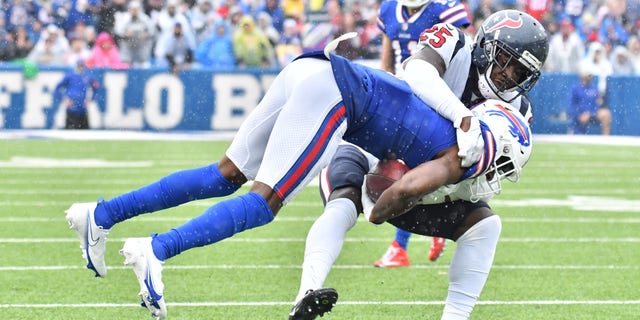 Houston Texans defensive back Desmond King (25) makes a tackle on Buffalo Bills wide receiver Emmanuel Sanders (1) in the third quarter at Highmark Stadium.