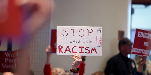 Opponents of an academic doctrine known as Critical Race Theory attend a packed Loudoun County School board meeting until the meeting erupted into chaos and two people were detained, in Ashburn, Virginia, U.S. June 22, 2021.