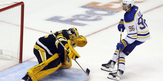 Pittsburgh Penguins goaltender Casey DeSmith (1) makes a save against Buffalo Sabres left wing Anders Bjork (96) to secure a Pens victory during a shootout Oct. 5, 2021, at PPG Paints Arena in Pittsburgh. The Penguins won, 5-4, in a shootout.