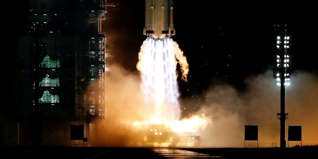 The Long March-2F Y13 rocket, carrying the Shenzhou-13 spacecraft and three astronauts in China's second crewed mission to build its own space station, launches at Jiuquan Satellite Launch Center near Jiuquan, Gansu province, China October 16, 2021.