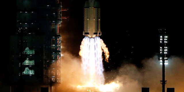 The Long March-2F Y13 rocket, carrying the Shenzhou-13 spacecraft and three astronauts in China's second crewed mission to build its own space station, launches at Jiuquan Satellite Launch Center near Jiuquan, Gansu province, China October 16, 2021.