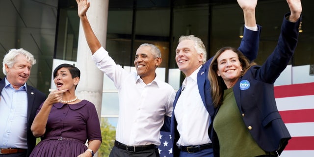 Virginia Attorney General Mark Herring, Lieutenant Governor Candidate and Virginia State Delegate Hala Alaya, former U.S. President Barack Obama and Virginia Democratic gubernatorial candidate Terry McAuliffe and his wife Dorothy McAuliffe gesture during a campaign rally for Virginia Democratic gubernatorial candidate Terry McAuliffe in Richmond, Va., Oct. 23, 2021. REUTERS/Kevin Lamarque