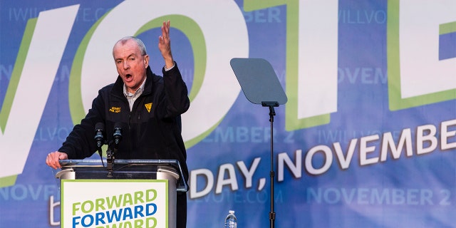 Gov. Phil Murphy speaks at an early vote rally at Weequahic Park, Saturday, Oct. 23, 2021, in Newark, N.J. (AP Photo/Stefan Jeremiah)