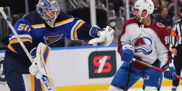 Jordan Binnington (50) of the St. Louis Blues makes a save against Nazem Kadri (91) of the Colorado Avalanche in the first period at Enterprise Center on Oct. 28, 2021, in St Louis, Missouri.