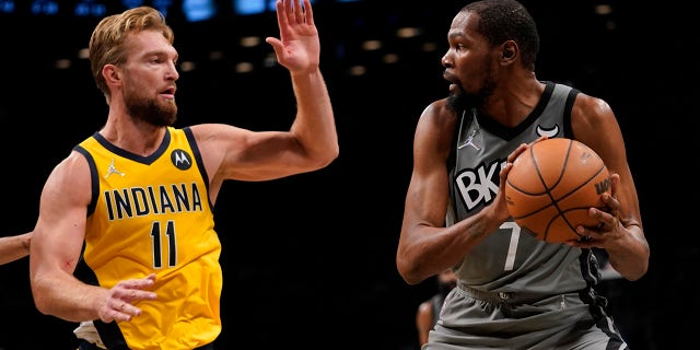 Indiana Pacers forward Domantas Sabonis (11) defends against Brooklyn Nets forward Kevin Durant (7) during the second half of an NBA basketball game, Friday, Oct. 29, 2021, in New York. The Nets won 105-98.