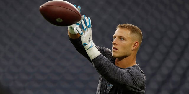 HOUSTON, TEXAS - SEPTEMBER 23: Christian McCaffrey #22 of the Carolina Panthers warms up prior to playing the Houston Texans at NRG Stadium on September 23, 2021 in Houston, Texas.