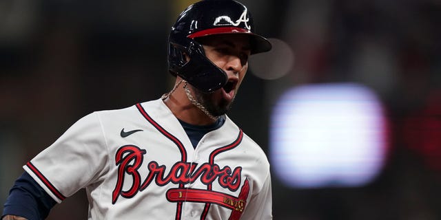 Atlanta Braves' Eddie Rosario celebrates after hitting a three run home run during the fourth inning in Game 6 of baseball's National League Championship Series against the Los Angeles Dodgers Saturday, Okt.. 23, 2021, in Atlanta.