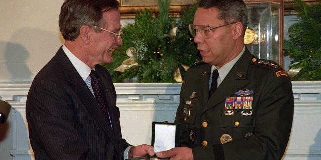President Bush presenting Joint Chiefs of Staff Chairman Gen. Colin Powell with a Congressional Gold Medal at the White House in 1992.