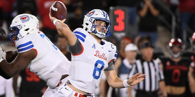 SMU quarterback Tanner Mordecai (8) attempts to throw the ball against Houston during the first half of an NCAA college football game Saturday, Oct. 30, 2021, in Houston. 