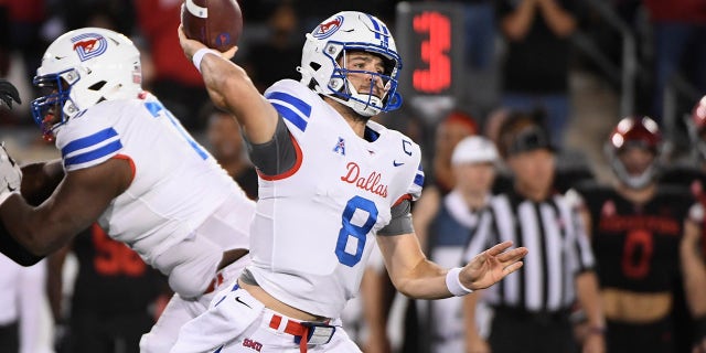 SMU quarterback Tanner Mordecai (8) attempts to throw the ball against Houston during the first half of an NCAA college football game Saturday, Oct. 30, 2021, in Houston. 