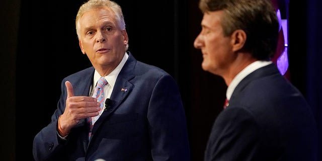 Democratic gubernatorial candidate former Governor Terry McAuliffe, left, gestures as Republican challenger, Glenn Youngkin, listens during a debate at the Appalachian School of Law in Grundy, Va., Thursday, Sept. 16, 2021. (AP Photo/Steve Helber)