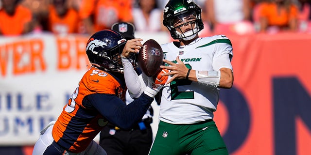 New York Jets quarterback Zach Wilson is sacked by Denver Broncos outside linebacker Von Miller during the first half of an NFL football game, Sunday, Sept. 26, 2021, in Denver. (AP Photo/Jack Dempsey)