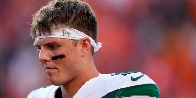 New York Jets quarterback Zach Wilson leaves the field after an NFL football game against the Denver Broncos , Sunday, Sept. 26, 2021, in Denver. The Broncos won 26-0.