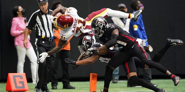 Washington Football Team running back J.D. McKissic (41) dives toward the end zone for a touchdown against the Atlanta Falcons during the second half of an NFL football game, Sunday, Oct. 3, 2021, in Atlanta. The Washington Football Team won 34-30.