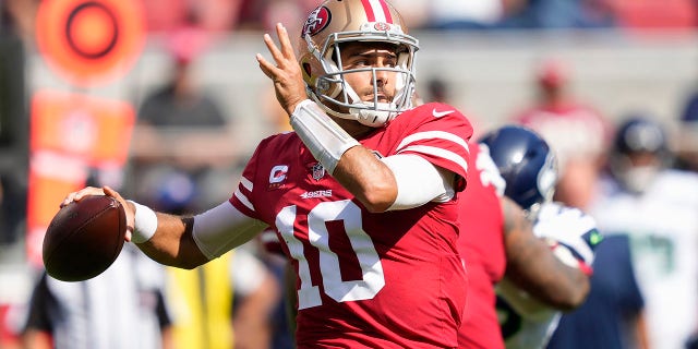 San Francisco 49ers quarterback Jimmy Garoppolo (10) passes against the Seattle Seahawks during the first half of an NFL football game in Santa Clara, Calif., Sunday, Oct. 3, 2021.
