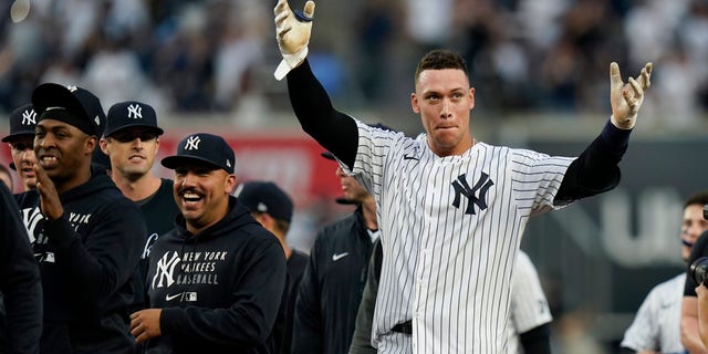 New York Yankees' Aaron Judge, right, gestures to fans after a baseball game against the Tampa Bay Rays Sunday, Oct. 3, 2021, in New York. The Yankees won 1-0.