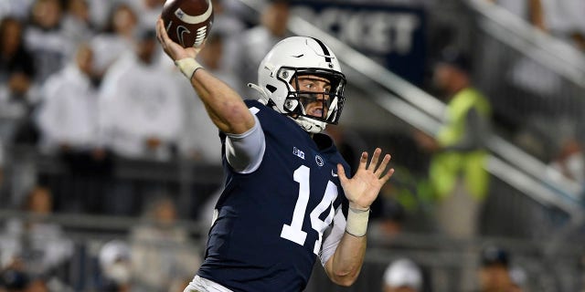 FILE - Penn State quarterback Sean Clifford (14) passes against Indiana in the first half of their NCAA college football game in State College, Pa., in this Saturday, Oct. 2, 2021, file photo. The key matchup in fourth-ranked Penn State's showdown with No. 3 Iowa pits the Nittany Lions' passing combo of Sean Clifford and Jahan Dotson against a defense that leads the nation with 12 interceptions.