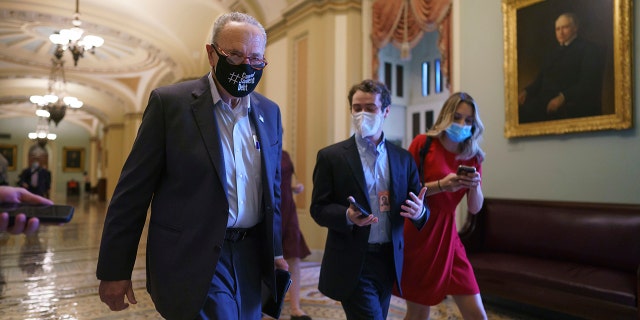 Senate Majority Leader Chuck Schumer, D-N.Y., finishes a meeting with White House officials and Senate Democrats before taking steps to move on the debt limit without Republican votes, at the Capitol in Washington, Wednesday, Oct. 6, 2021. (AP Photo/J. Scott Applewhite)