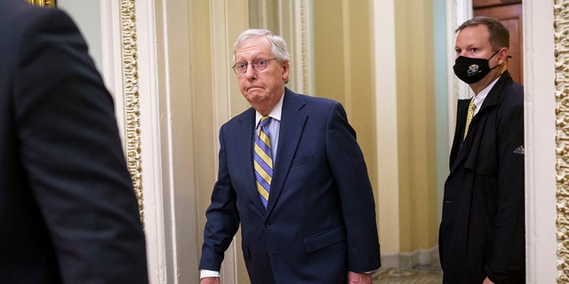 Senate Minority Leader Mitch McConnell, R-Ky., arrives at the Capitol in Washington.