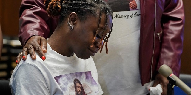 Aliyah, left, and Laverne Butler, sister and mother of Sarah Butler, wear shirts with Sarah Butler's picture as they give victim impact statements during the sentencing for Khalil Wheeler-Weaver in Newark, N.J., Wednesday, Oct. 6, 2021. Wheeler-Weaver, a New Jersey man who used dating apps to lure three women, including Robin West, to their deaths and attempted to kill a fourth woman five years ago, was sentenced to 160 years in prison on Wednesday, as he defiantly proclaimed his innocence. (AP Photo/Seth Wenig, Pool)