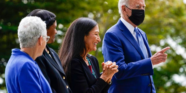 President Biden gestures during a White House ceremony with Interior Secretary Deb Haaland on Oct. 8, 2021.