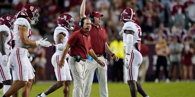 Alabama coach Nick Saban calls to players during a timeout in the first half of an NCAA college football game against Texas A&M on Saturday, Oct. 9, 2021, in College Station, Texas. (AP Photo/Sam Craft)