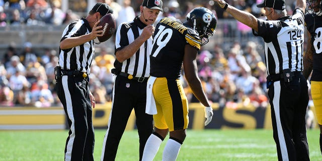 Pittsburgh Steelers wide receiver JuJu Smith-Schuster (19) gets up after being injured on a play during the first half of an NFL football game against the Denver Broncos in Pittsburgh, Sunday, Oct. 10, 2021. (AP Photo/Don Wright)