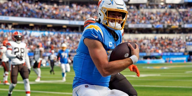 Los Angeles Chargers quarterback Justin Herbert scores a touchdown during the second half against the Cleveland Browns Sunday, Oct. 10, 2021, in Inglewood, Calif.