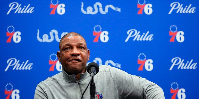 Philadelphia 76ers head coach Doc Rivers pauses while speaking to the media before a preseason NBA basketball game against the Brooklyn Nets, Monday, Oct. 11, 2021, in Philadelphia. Rivers says the franchise still wants disgruntled All-Star guard Ben Simmons to the return to the team. (AP Photo/Matt Slocum)