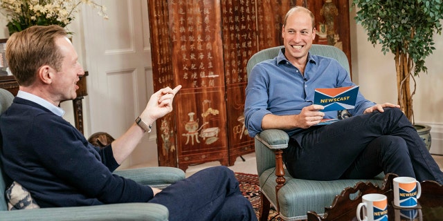 In this undated photo provided Tuesday, Oct. 12, 2021, Britain's Prince William, right, speaks with journalist Adam Fleming during the recording of an appearance on the program BBC Newscast, at Kensington Palace, London, in which Prince Williams discussed climate change ahead of the inaugural Earthshot Prize award ceremony on Sunday. (Kensington Palace via AP)