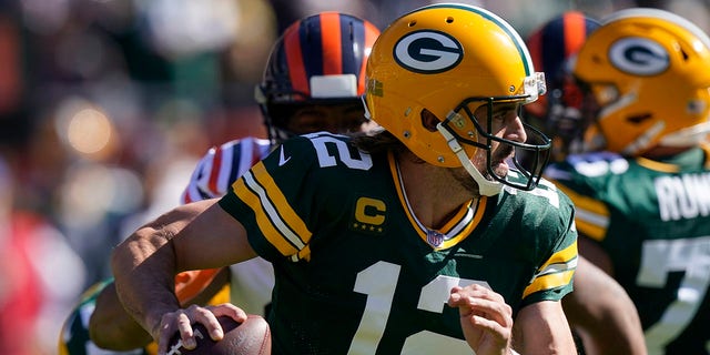 Green Bay Packers quarterback Aaron Rodgers scrambles during the first half against the Chicago Bears Oct. 17, 2021, in Chicago. 