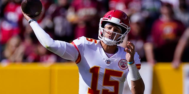 Kansas City Chiefs quarterback Patrick Mahomes (15) passing the ball during the first half of an NFL football game against the Washington Football Team, Sunday, Oct. 17, 2021, in Landover, Md.