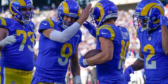 The Los Angeles Rams' Cooper Kupp, second from right, celebrates a touchdown with quarterback Matthew Stafford (9) during a game against the New York Giants Oct. 17, 2021, in East Rutherford, N.J.