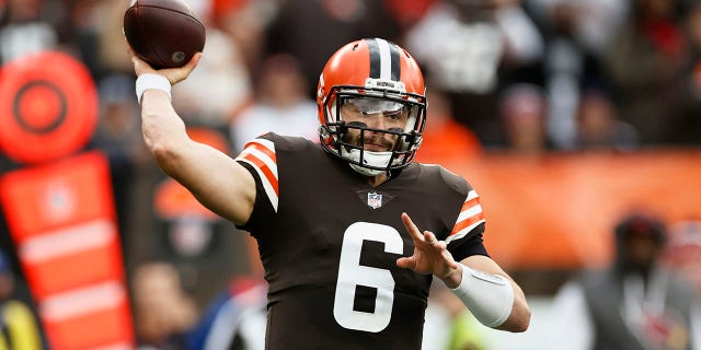 Cleveland Browns quarterback Baker Mayfield throws during the first half of an NFL football game against the Arizona Cardinals, Sunday, Oct. 17, 2021, in Cleveland.