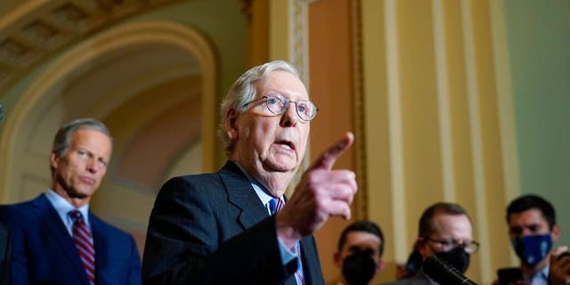 Senate Minority Leader Mitch McConnell, R-Ky., joined at left by Minority Whip John Thune, R-S.D., speaks to reporters after a Republican strategy meeting at the Capitol in Washington, Tuesday, Oct. 19, 2021. 