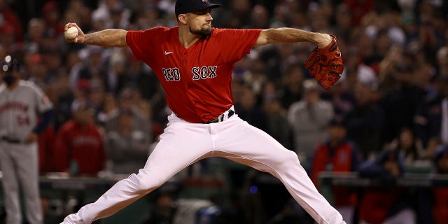 Boston Red Sox starting pitcher Nathan Eovaldi throws against the Houston Astros during the ninth inning of Game 4 of the American League Championship Series on October 19, 2021 in Boston.