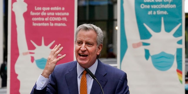 Former New York Mayor Bill de Blasio delivers his remarks in Times Square after he toured the grand opening of a Broadway COVID-19 vaccination site intended to jump-start the city's entertainment industry, in New York. (AP Photo/Richard Drew)