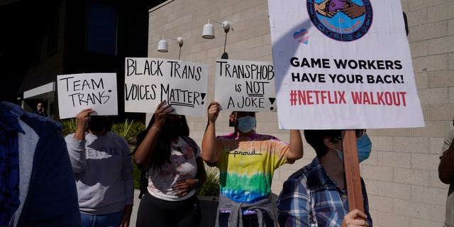 People protest outside the Netflix building in the Hollywood section of Los Angeles on Oct. 20, 2021.