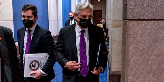 Attorney General Merrick Garland returns following a brief recess of a House Judiciary Committee oversight hearing of the Department of Justice on Capitol Hill in Washington, Thursday, Oct. 21, 2021. (AP Photo/Andrew Harnik)