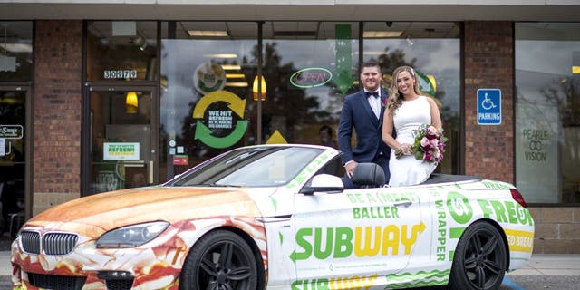 Newlyweds Julie Bushart and Zack Williams got to "Eat Fresh" and snap a few photos at the Subway where they first met.