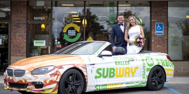 Newlyweds Julie Bushart and Zack Williams got to "Eat Fresh" and snap a few photos at the Subway where they first met.
