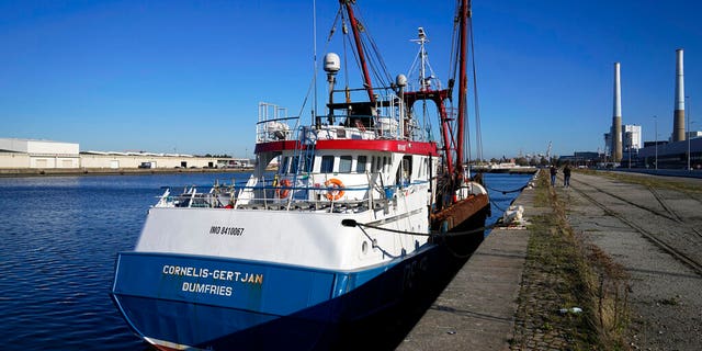The British trawler kept by French authorities docks at the port in Le Havre, western France, Thursday, Oct. 28, 2021. French authorities fined two British fishing vessels and kept one in port overnight Thursday Oct.28, 2021 amid a worsening dispute over fishing licenses that has stoked tensions following the U.K.'s departure from the European Union. (AP Photo/Michel Euler)