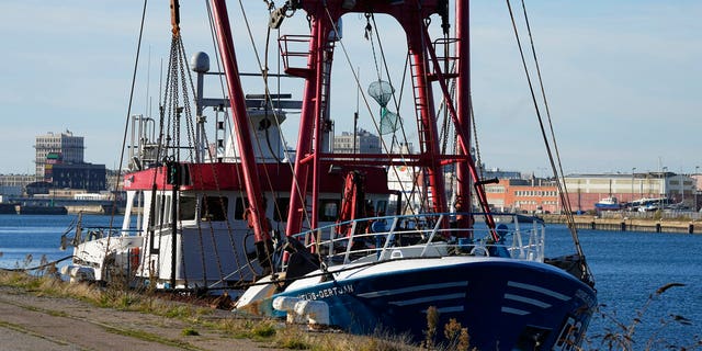 The British trawler kept by French authorities docks at the port in Le Havre, western France, Thursday, Oct. 28, 2021. French authorities fined two British fishing vessels and kept one in port overnight Thursday Oct.28, 2021 amid a worsening dispute over fishing licenses that has stoked tensions following the U.K.'s departure from the European Union. (AP Photo/Michel Euler)