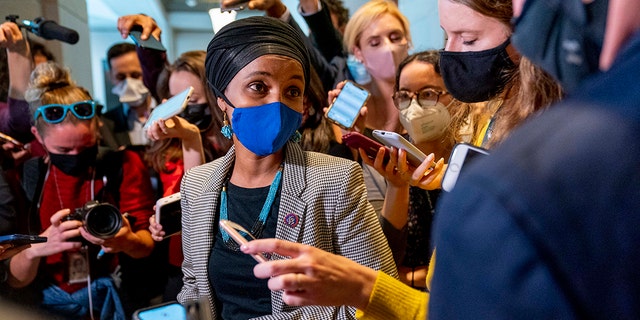 Rep. Ilhan Omar, D-Minnesota, speaks to reporters as she leaves a meeting of the House Democratic Progressive Caucus on Capitol Hill in Washington, Thursday, Oct. 28, 2021.