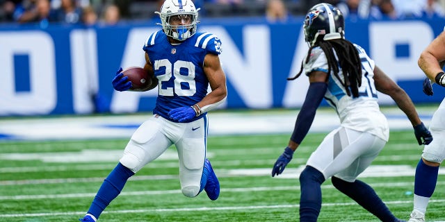 Indianapolis Colts running back Jonathan Taylor (28) tries to cut around Tennessee Titans cornerback Janoris Jenkins (20) in the first half Sunday, Oct. 31, 2021.