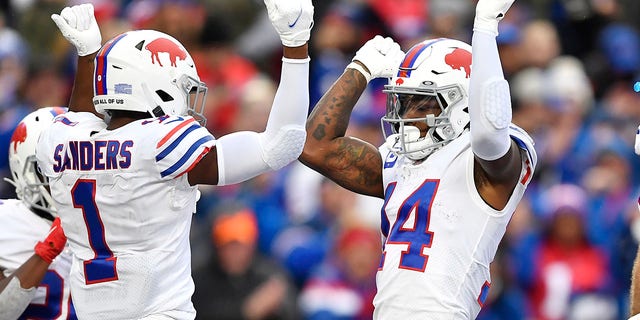 Buffalo Bills wide receiver Stefon Diggs (14) celebrates with Emmanuel Sanders (1) after his touchdown during the second half of an NFL football game against the Miami Dolphins, Sunday, Oct. 31, 2021, in Orchard Park, New York.