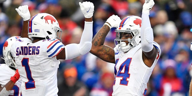 Buffalo Bills wide receiver Stefon Diggs (14) celebrates with Emmanuel Sanders (1) after his touchdown during the second half of an NFL football game against the Miami Dolphins, Sunday, Oct. 31, 2021, in Orchard Park, New York.